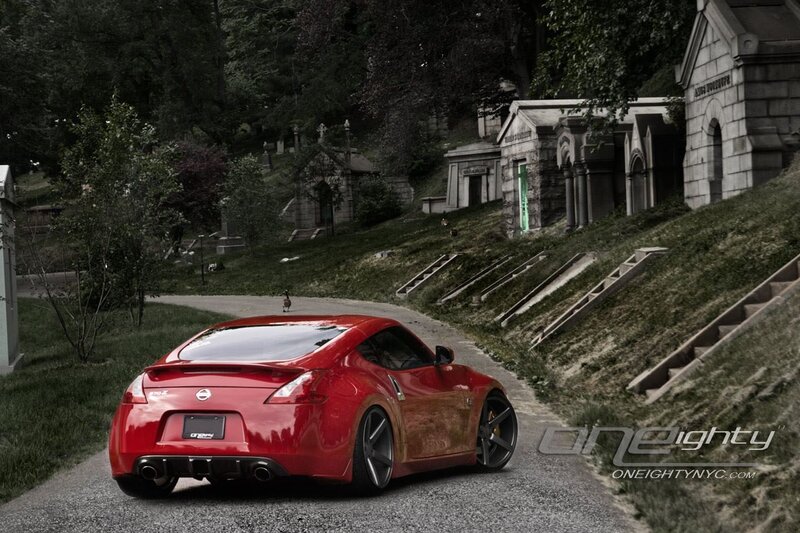Red Nissan 370Z in a cemetery