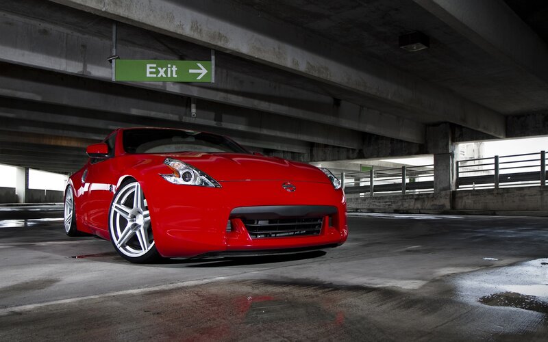 Red Nissan 370Z in parking garage