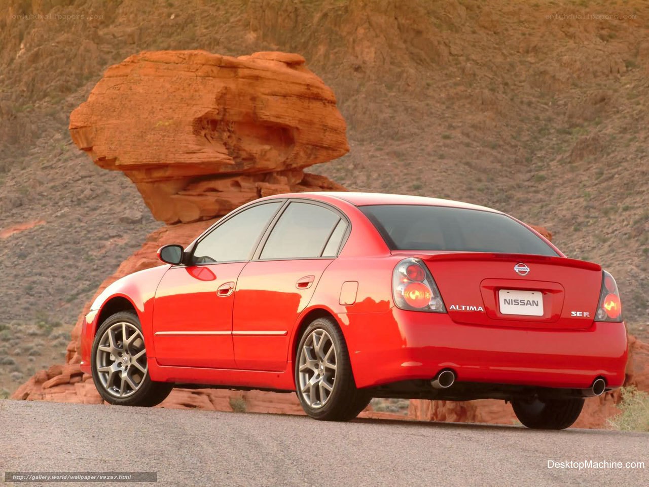 Red Nissan Altima on desert road