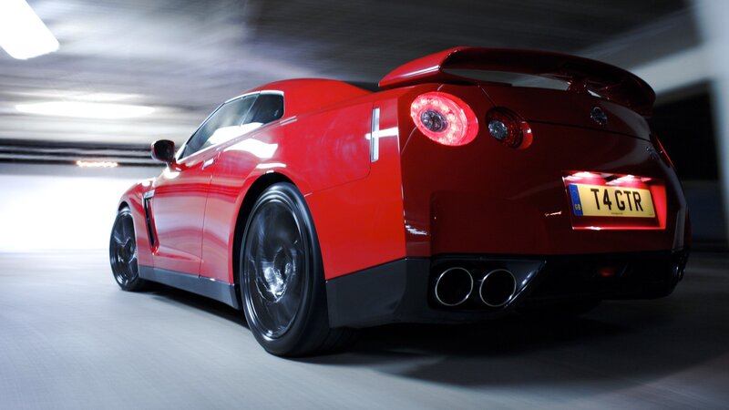 Red Nissan GT-R in motion