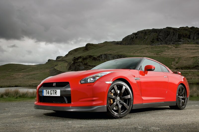 Red Nissan GT-R on a gravel road