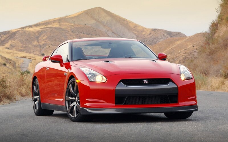 Red Nissan GT-R on a mountain road