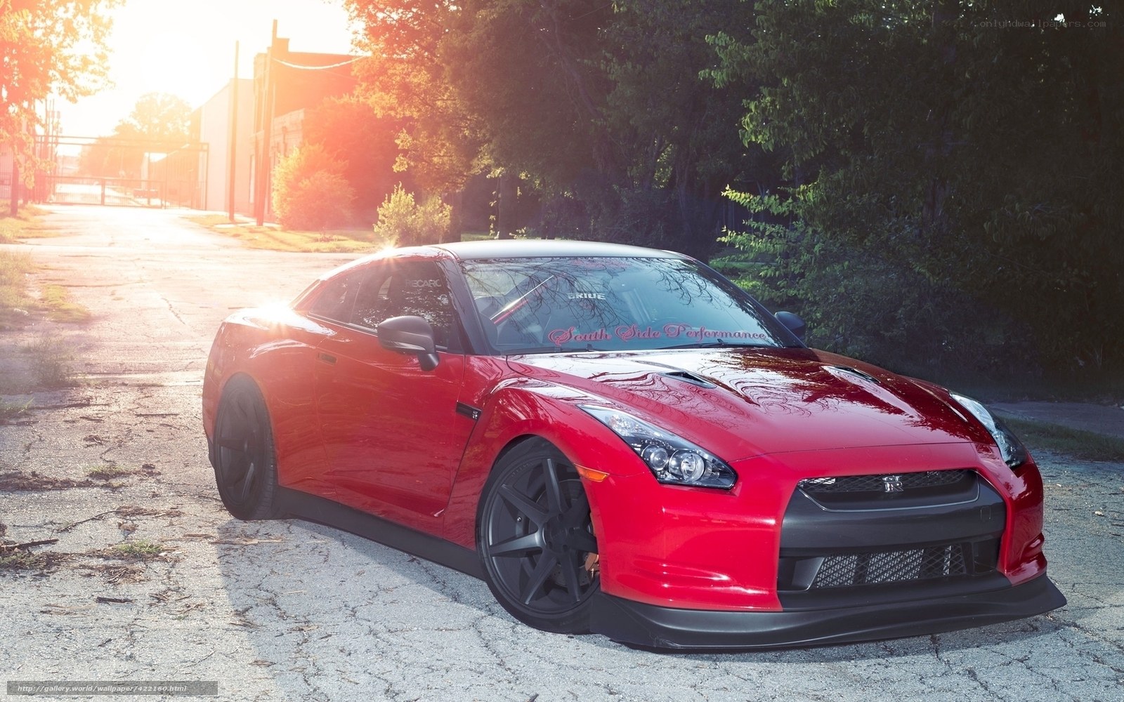 Red Nissan GT-R on a quiet street
