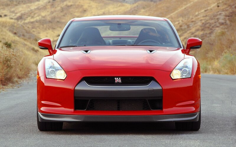 Red Nissan GT-R on a road