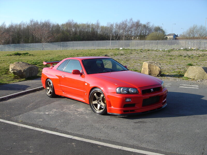 Red Nissan GT-R parked in lot