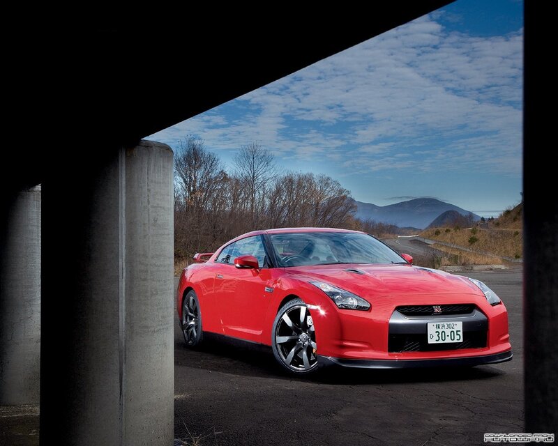 Red Nissan GT-R under overpass