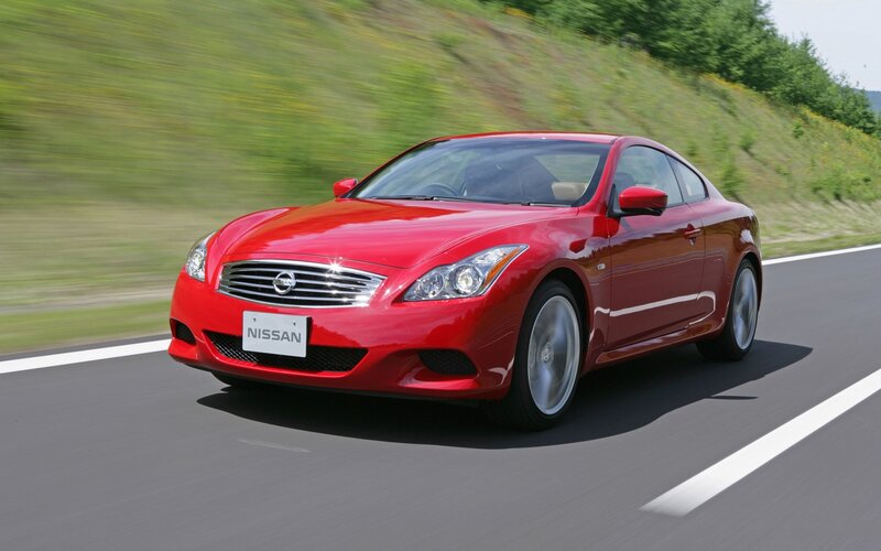 Red Nissan Infiniti driving on road