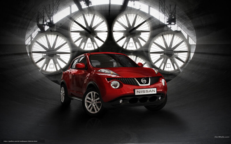 Red Nissan Juke in industrial tunnel