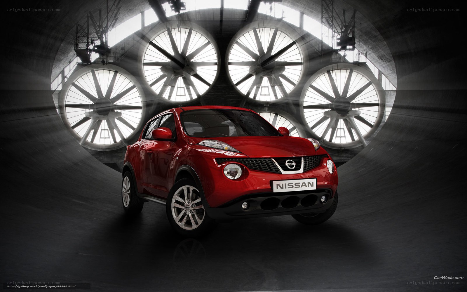 Red Nissan Juke in industrial tunnel