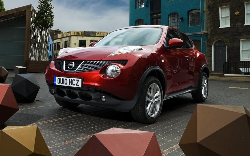 Red Nissan Juke on city street