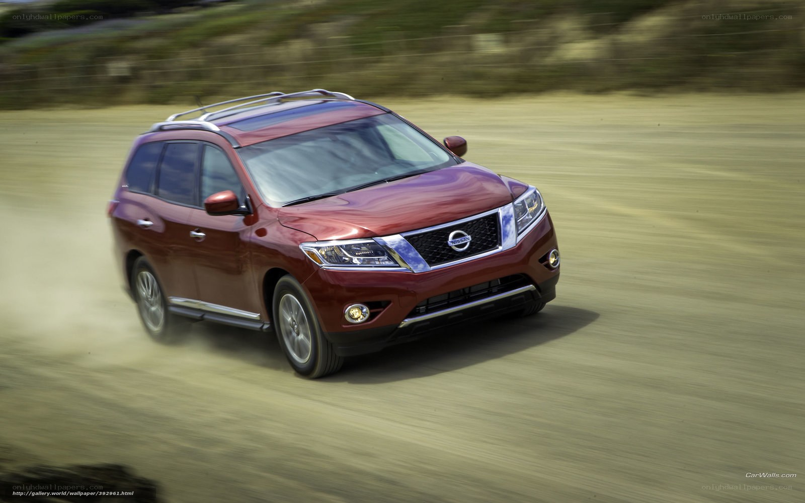 Red Nissan Pathfinder in motion