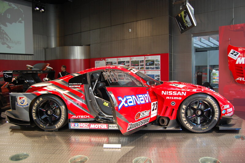 Red Nissan race car on display