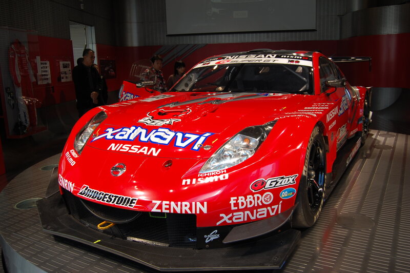 Red Nissan race car on display