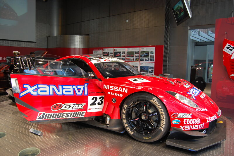 Red Nissan race car on display