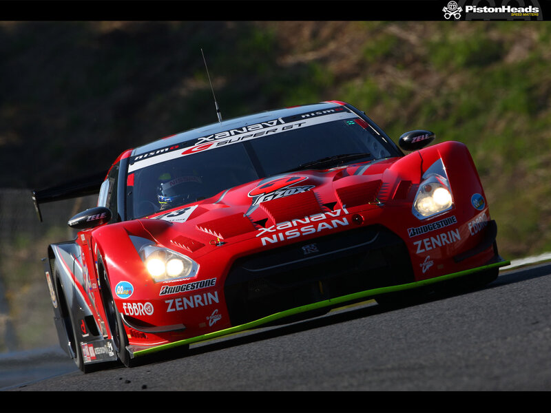 red nissan race car on track