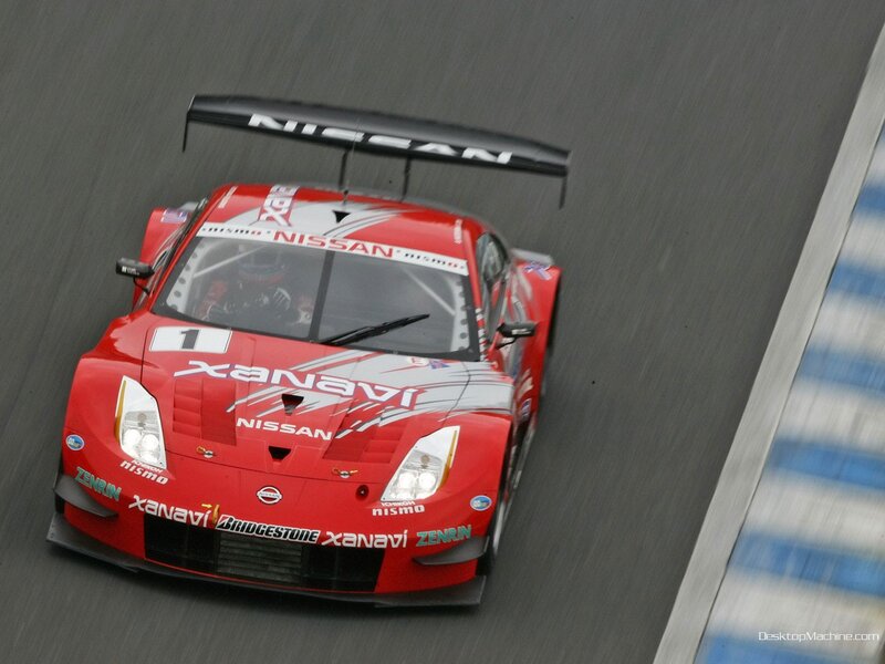 Red Nissan race car on track