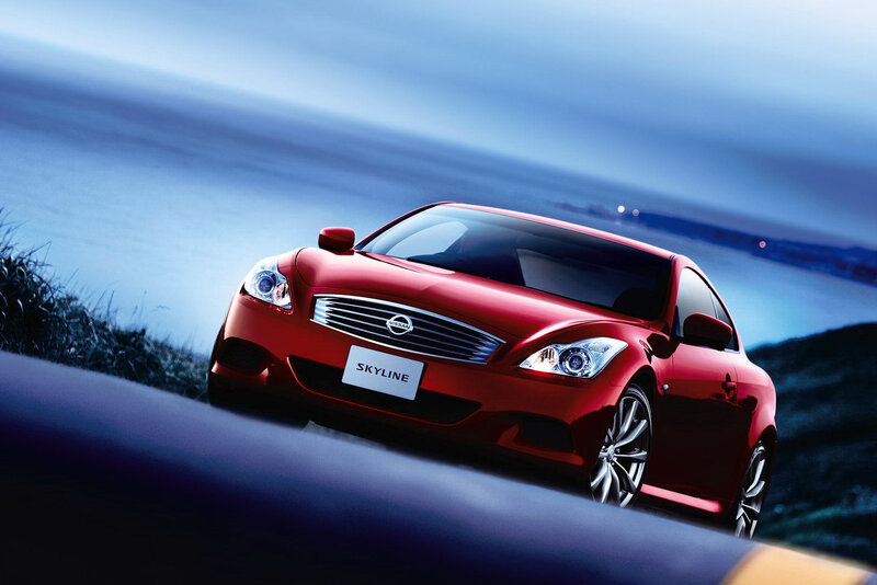 Red Nissan Skyline on coastal road