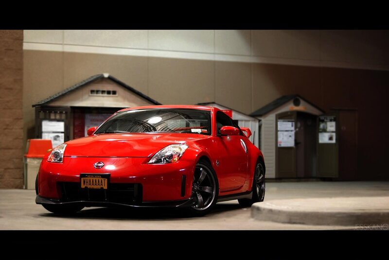 Red Nissan sports car in garage