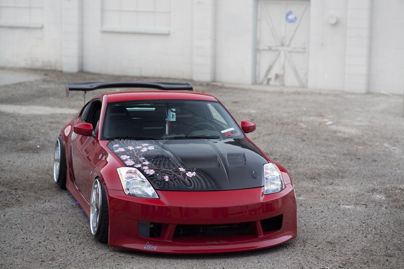 Red Nissan sports car with custom graphics