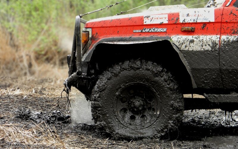 Red Off-road Vehicle — Dusty