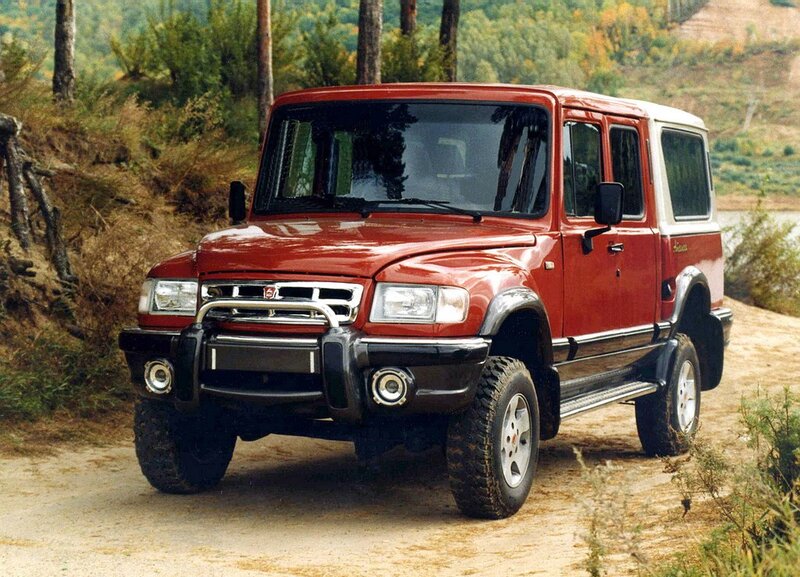 Red off-road vehicle on dirt path