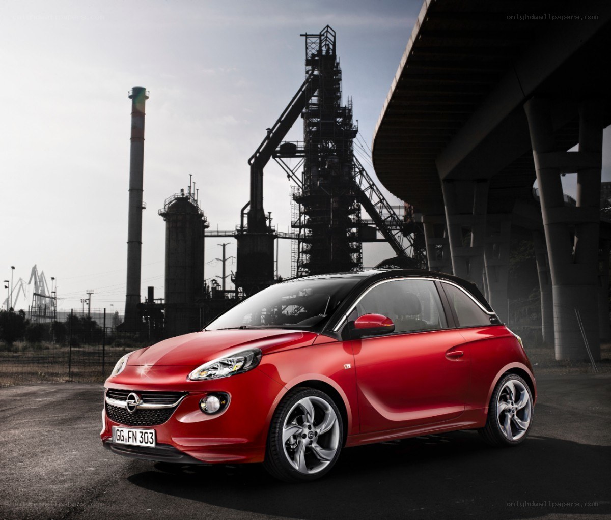 Red Opel Adam in industrial setting
