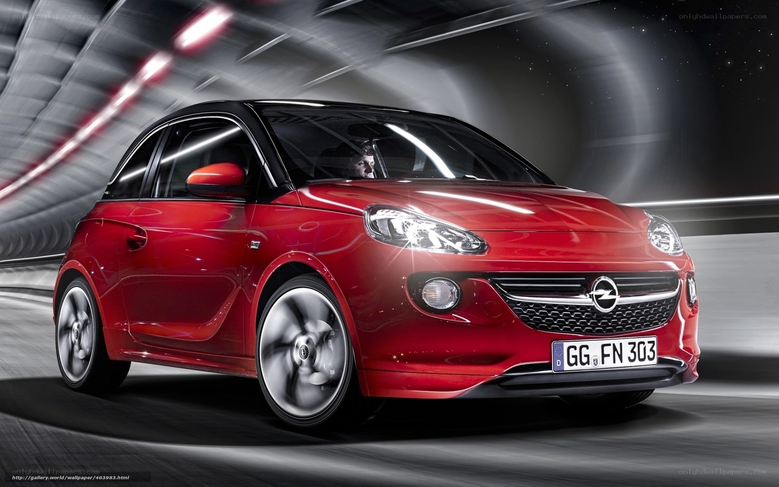 Red Opel Adam in motion