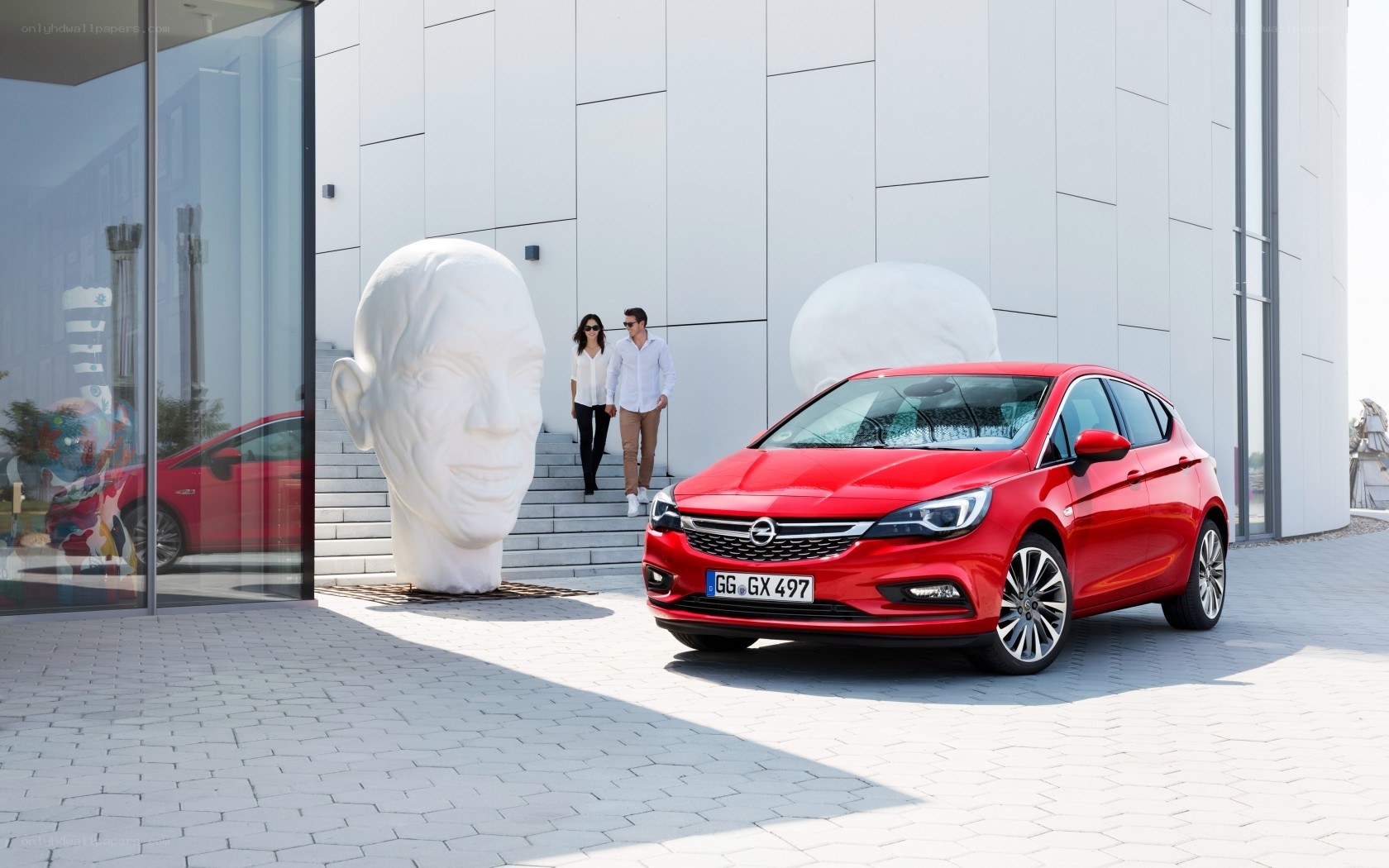 Red Opel Astra in modern setting