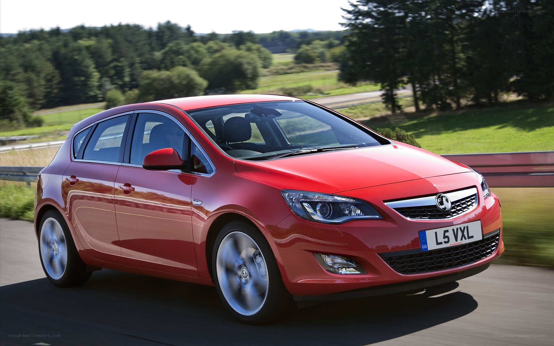Red Opel Astra in motion