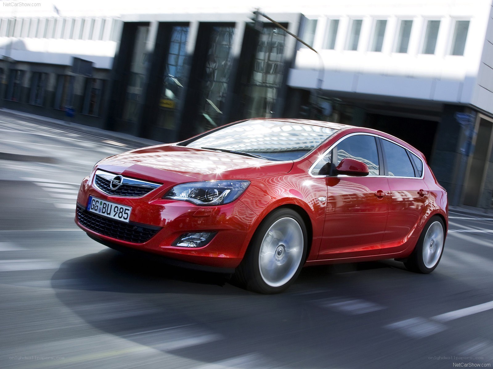 Red Opel Astra in motion