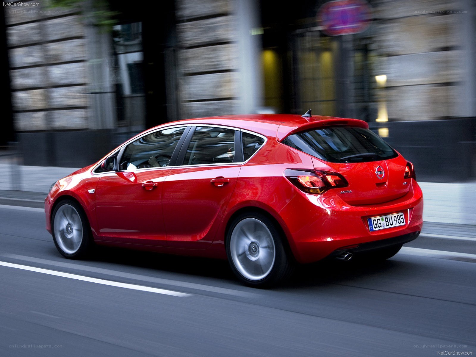 Red Opel Astra in motion