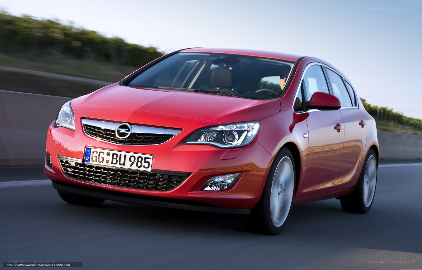 Red Opel Astra in motion