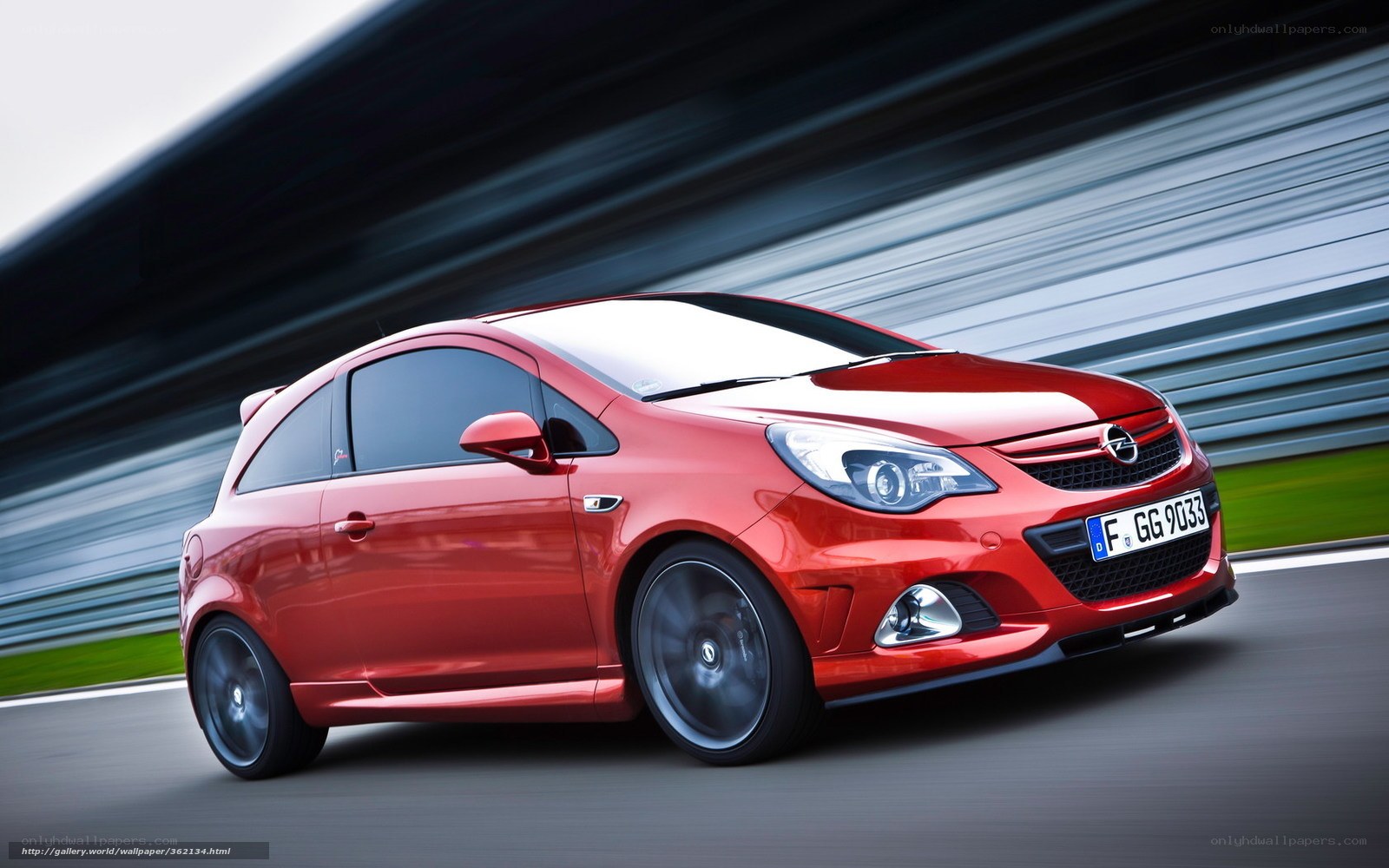 Red Opel Corsa on a racetrack