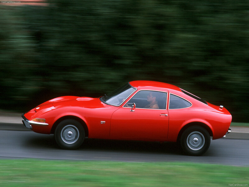 Red Opel GT in motion