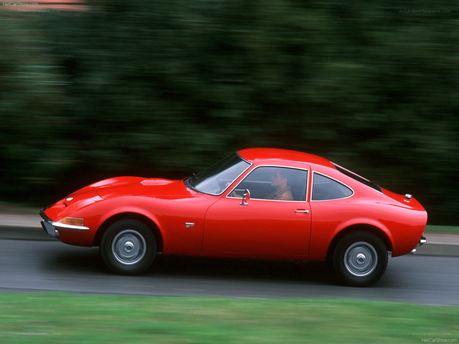 Red Opel GT in motion