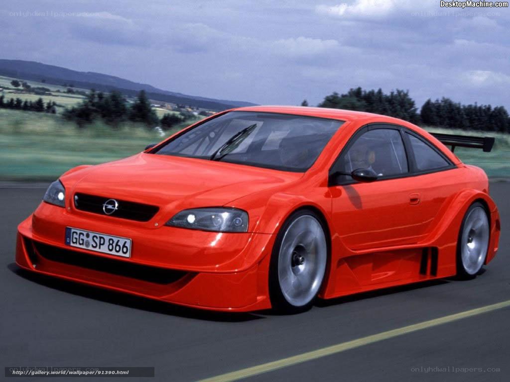 Red Opel race car on track