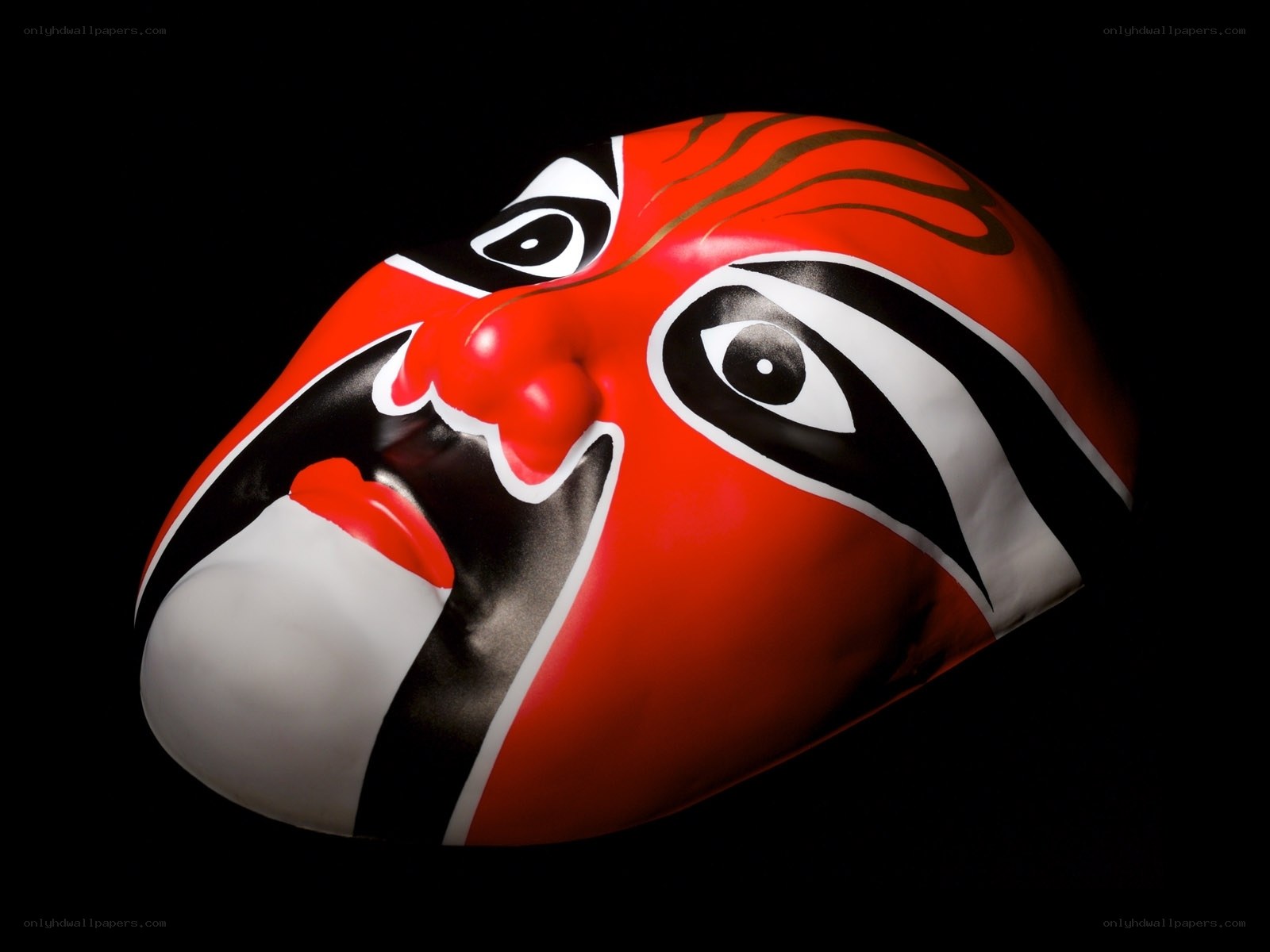red opera mask on black