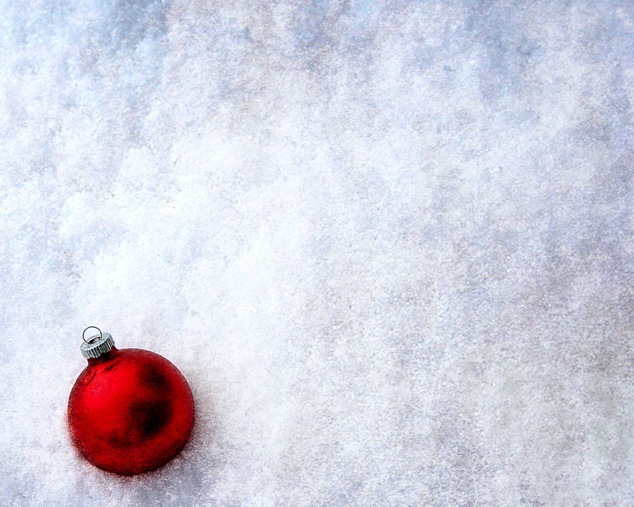 Red ornament in snow