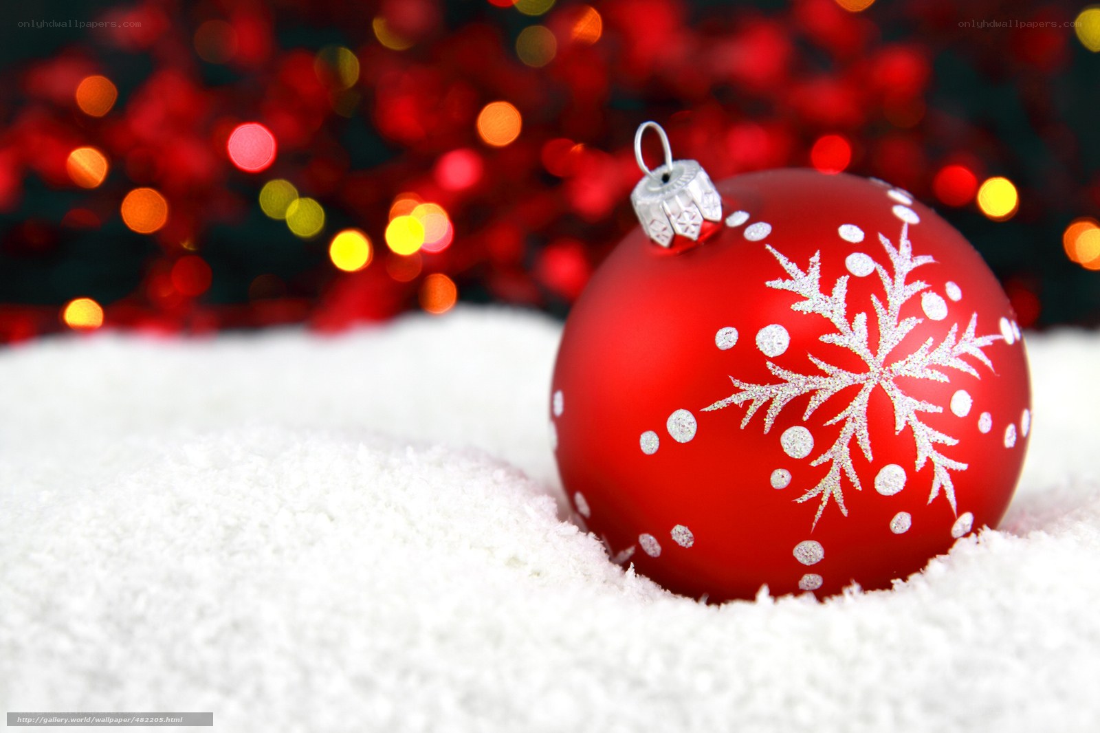 Red ornament in snow