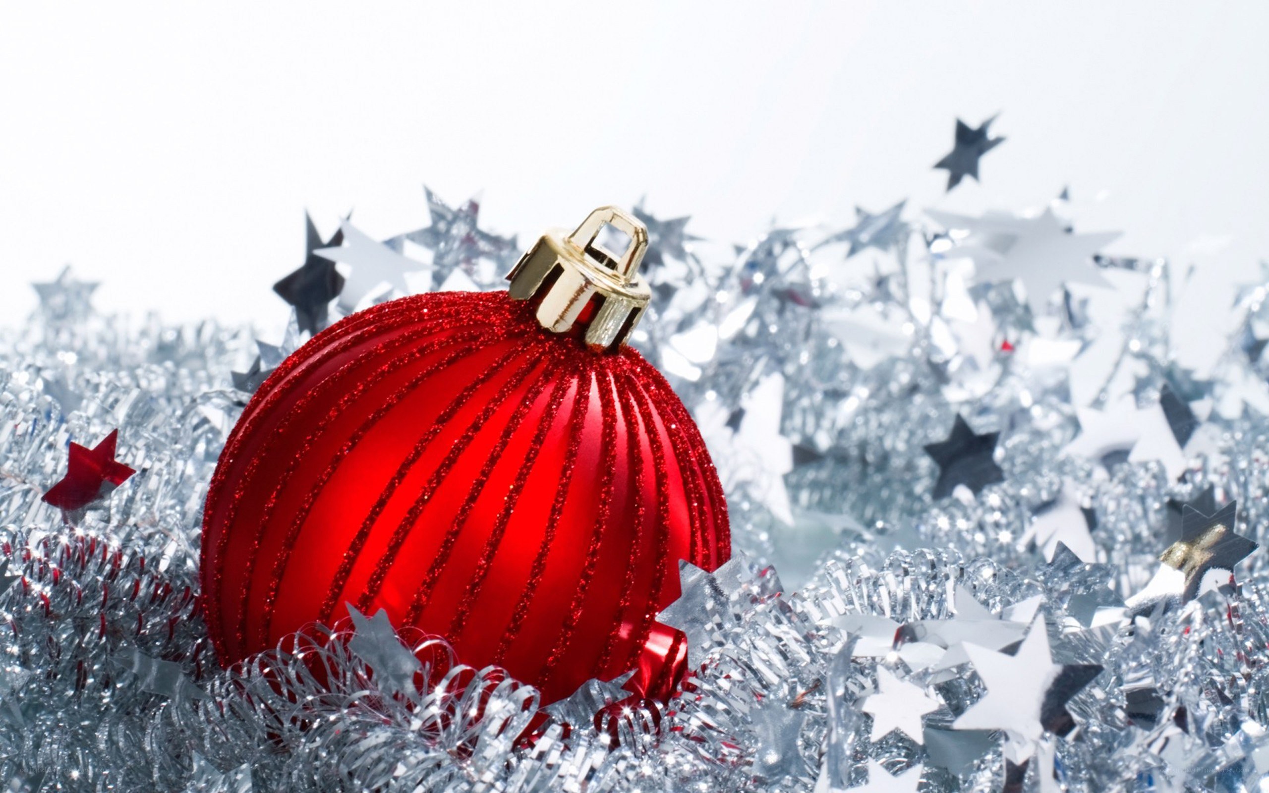 Red ornament on silver tinsel