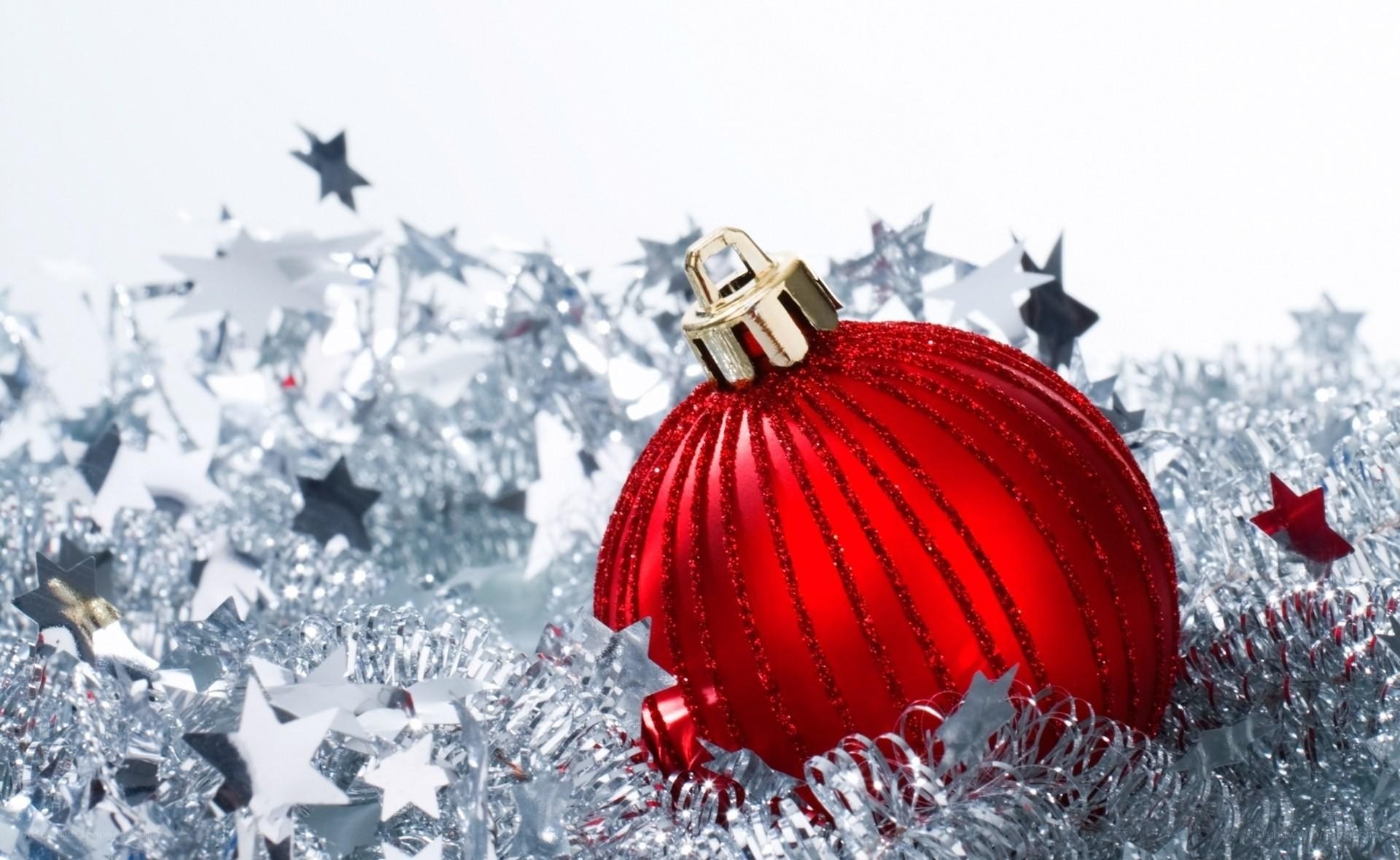 Red ornament on silver tinsel
