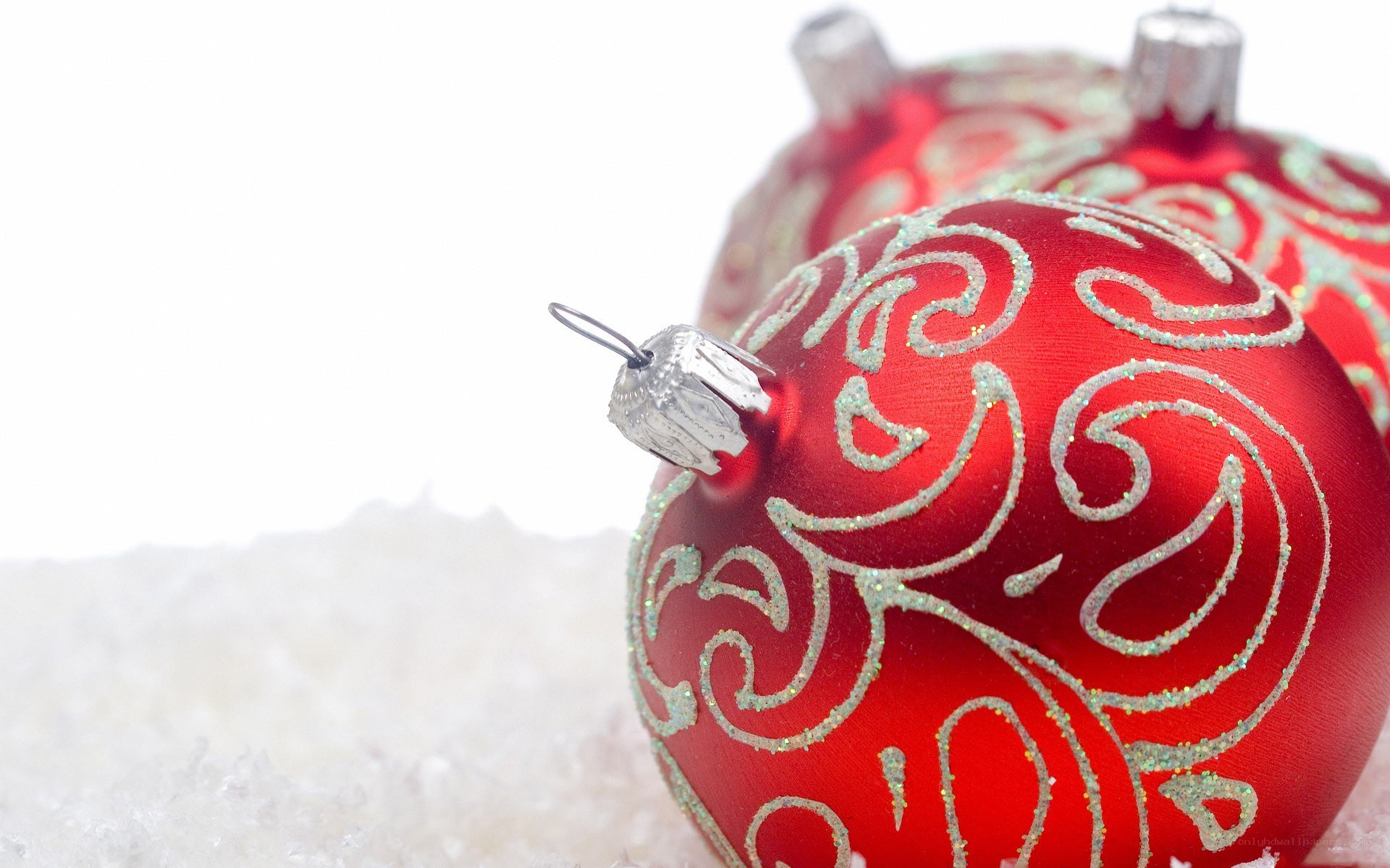 red ornament on snow
