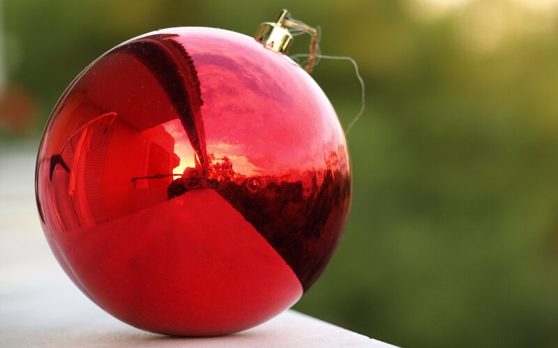 Red Ornament on Surface — Calm