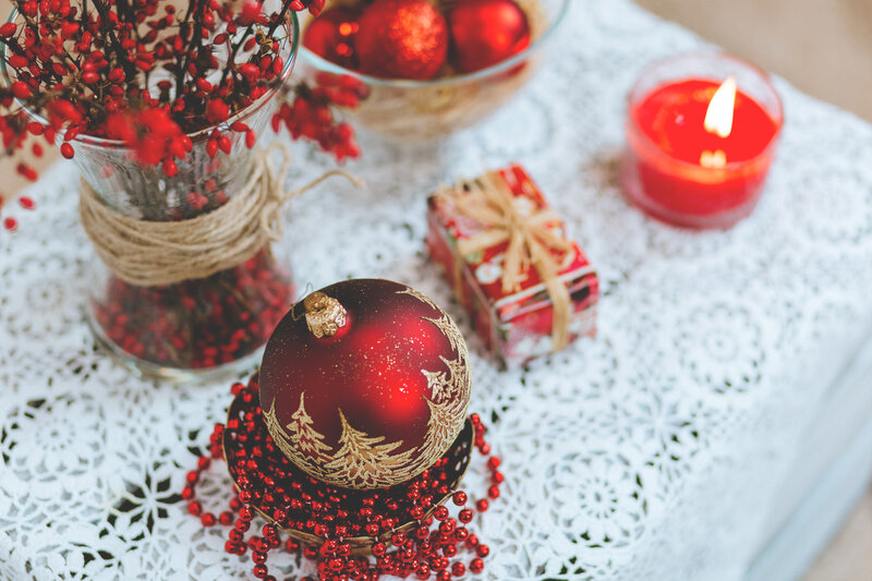 Red Ornament on Table — Festive, Winter, Photograph, Candle