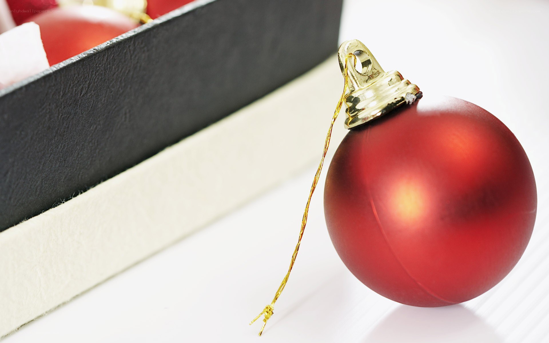 Red ornament on white surface