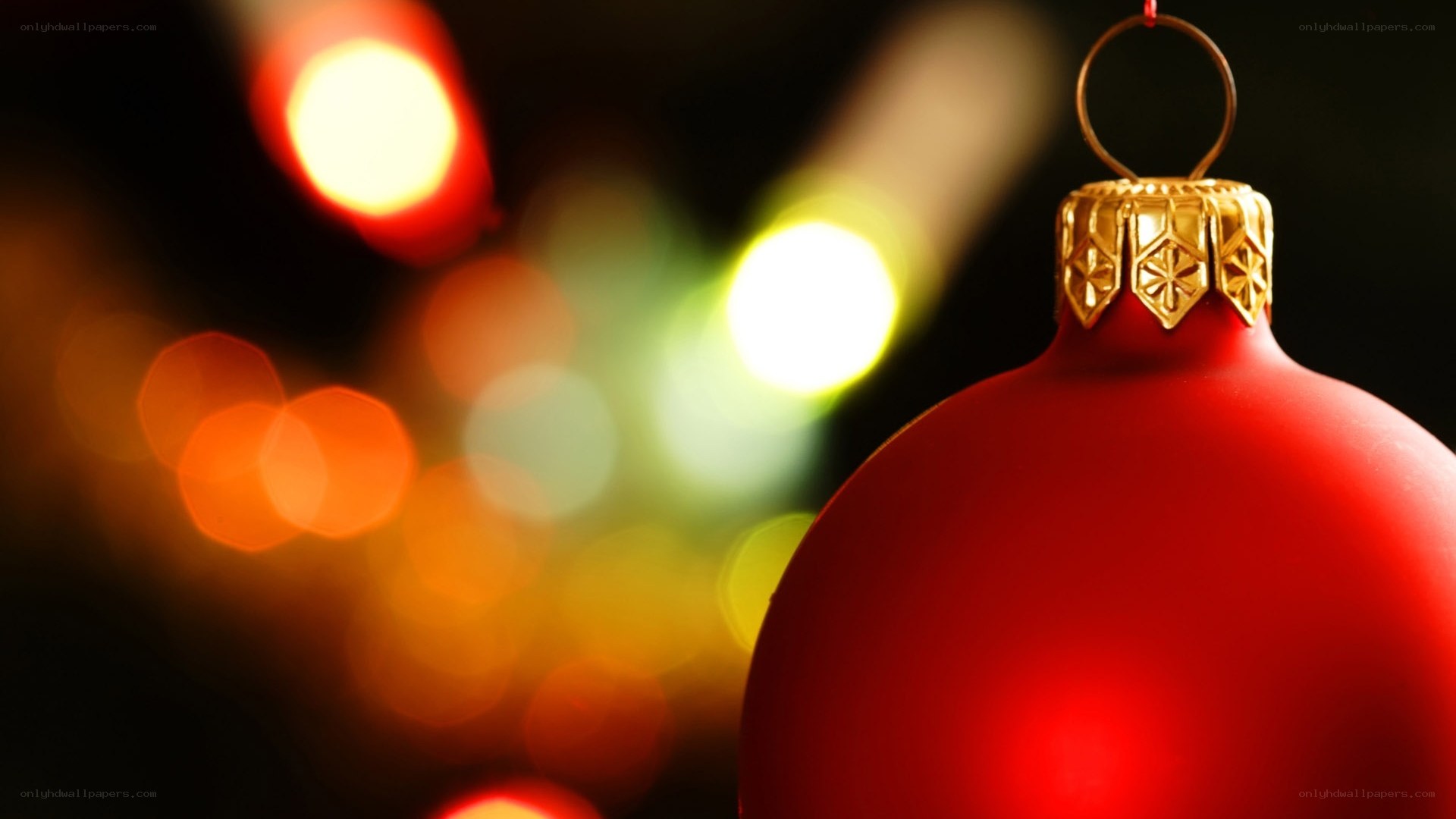 red ornament with bokeh lights