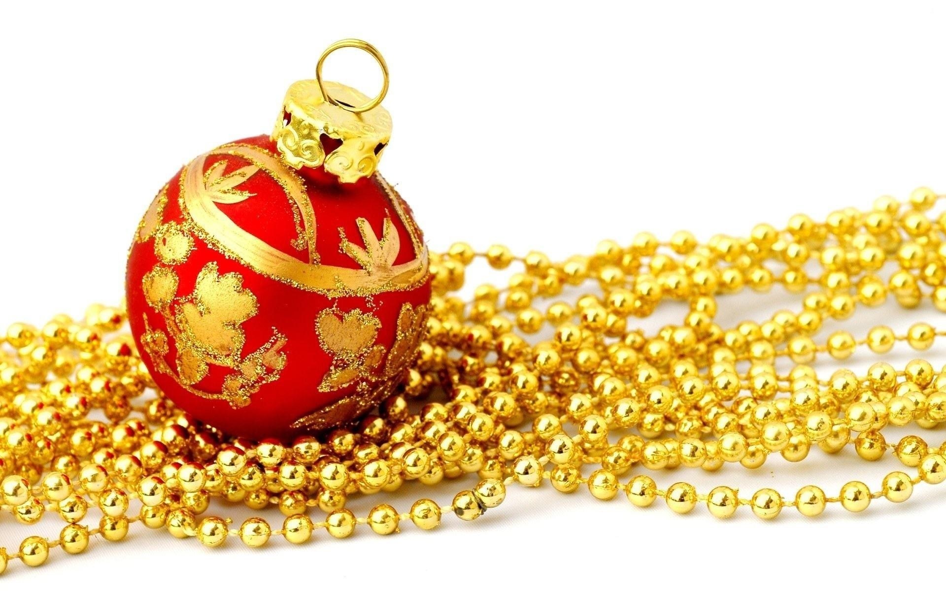 red ornament with gold beads