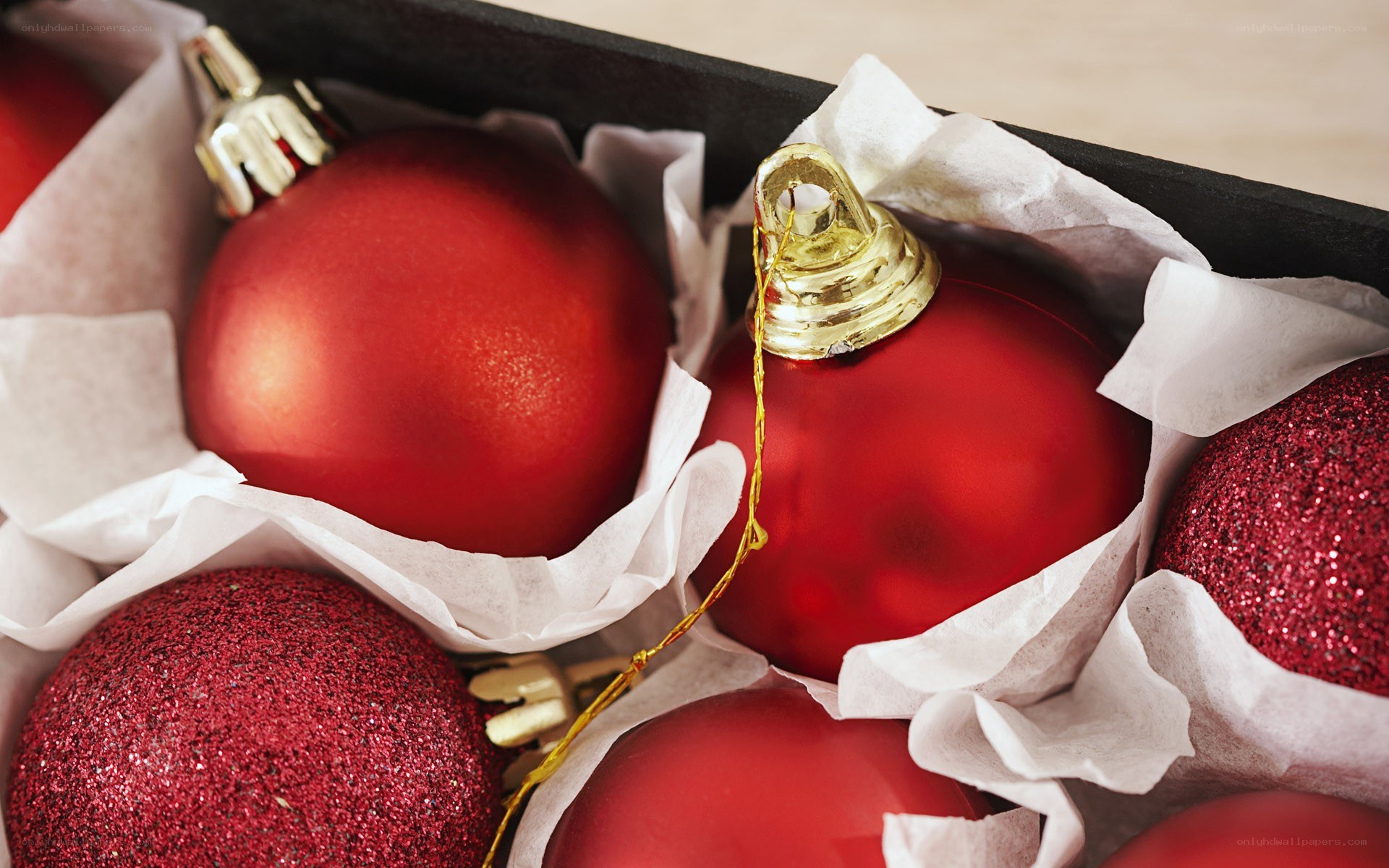 Red ornaments in a box