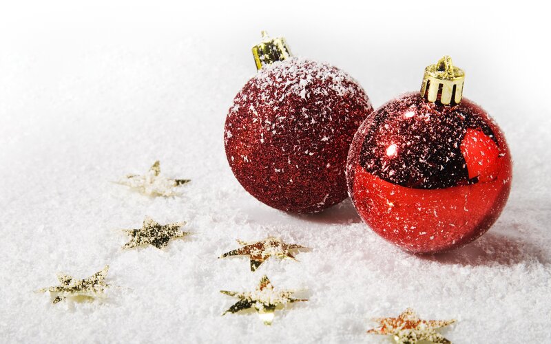 Red ornaments in snow