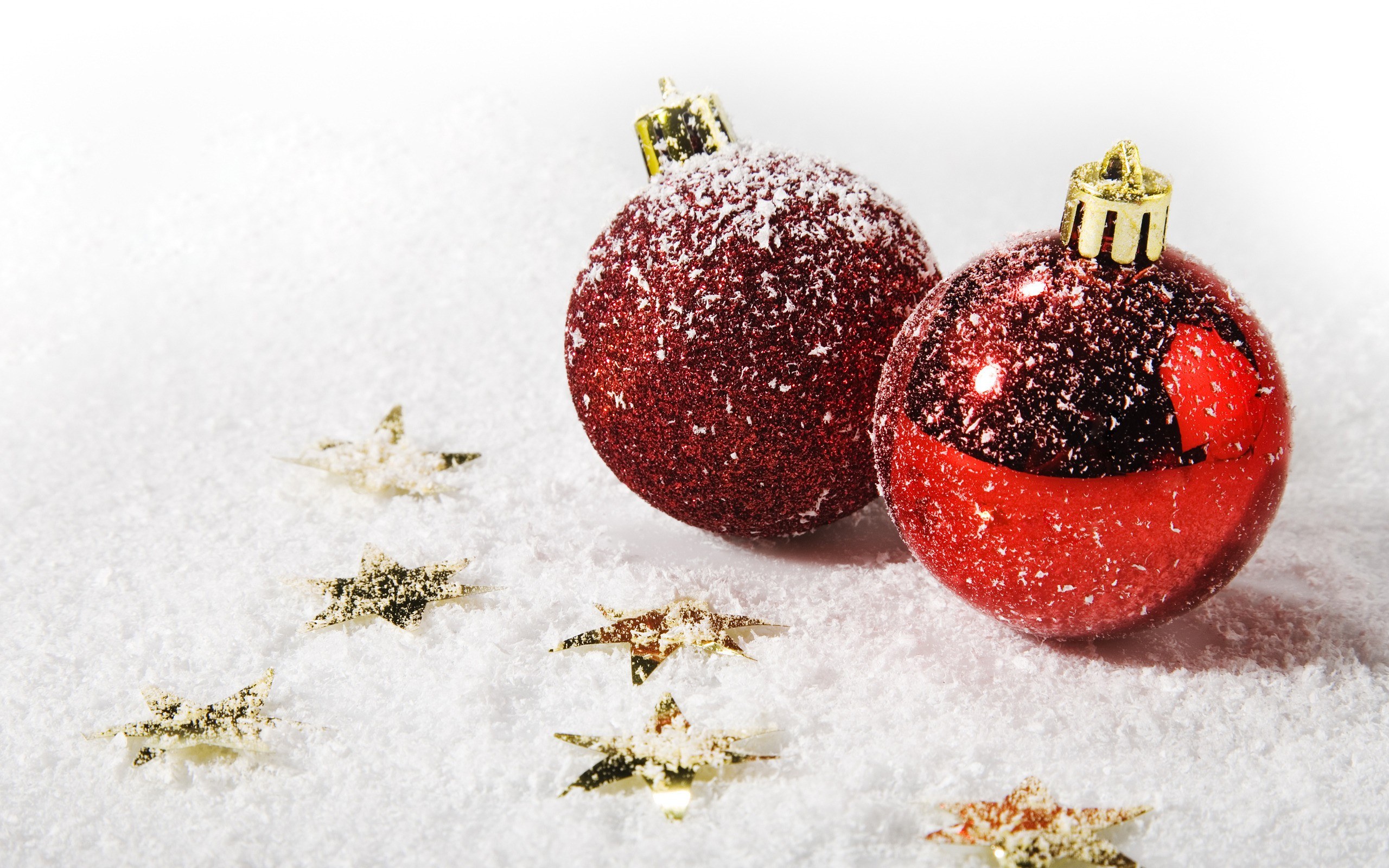 Red ornaments in snow